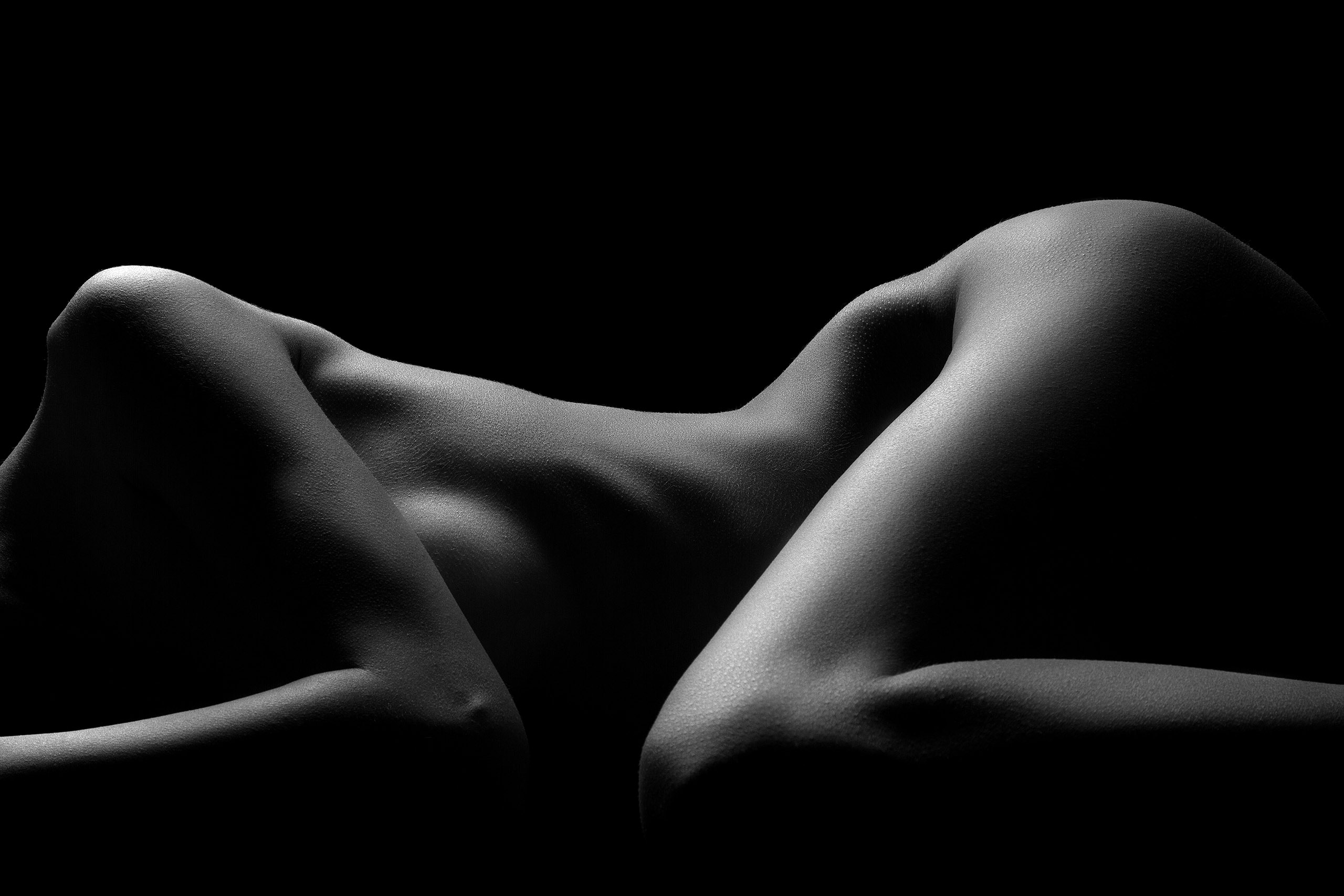 contour outline of a female silhouette while she's laying down to symbolize the body