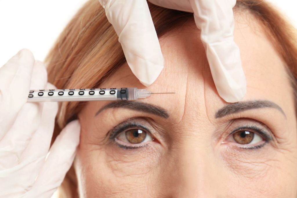Botox injection into forehead lines above the brow